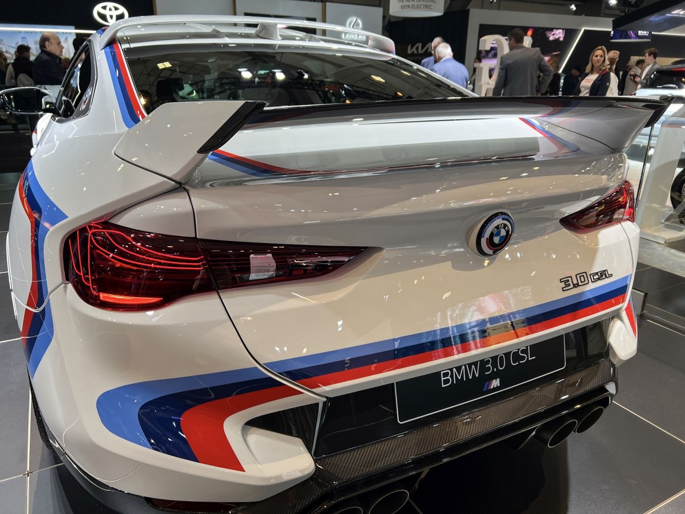 Rear of car with large racing spoiler and distinctive M stripes
