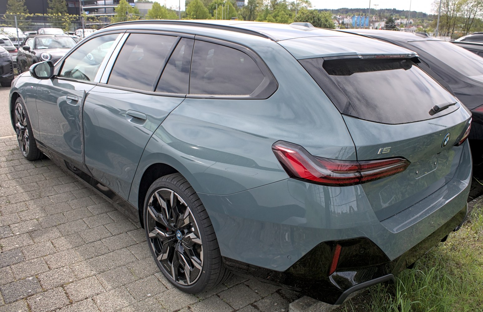 Rear-side view of electric station wagon with sleek alloy wheels
