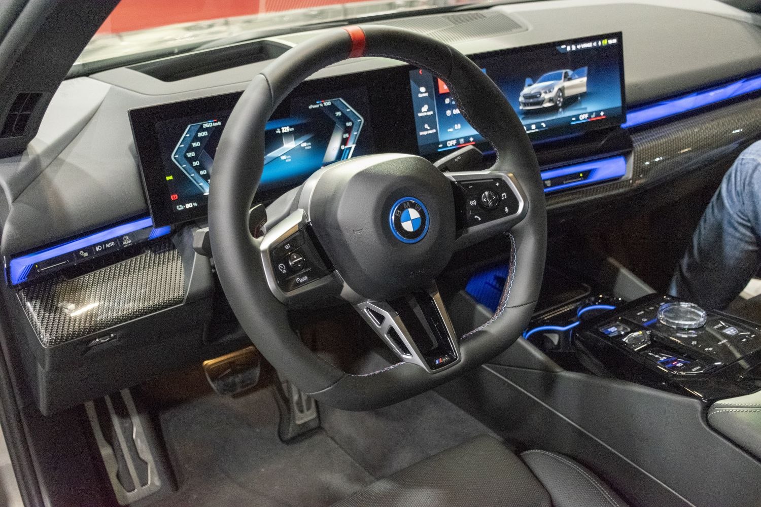 Digital instrument cluster and multifunction steering wheel with carbon fiber trim and ambient lighting
