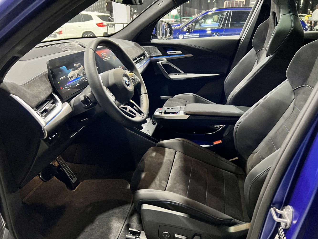 Modern digital dashboard and ergonomic front seats in a premium SUV interior