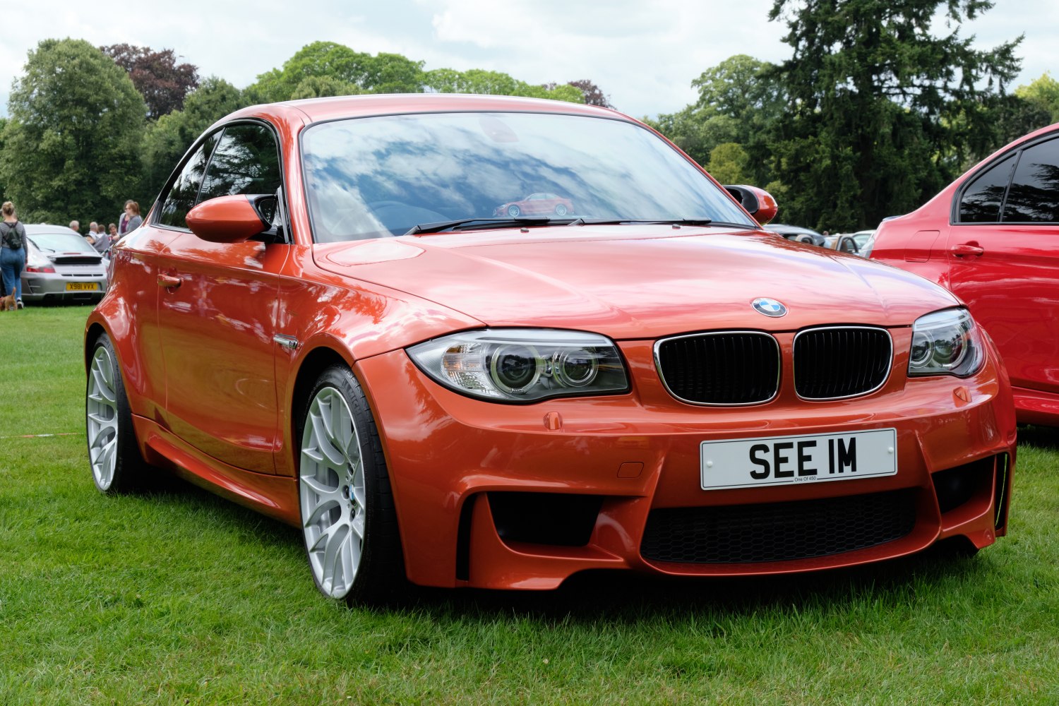 Front view of sporty coupe with distinctive headlights and aggressive bumper