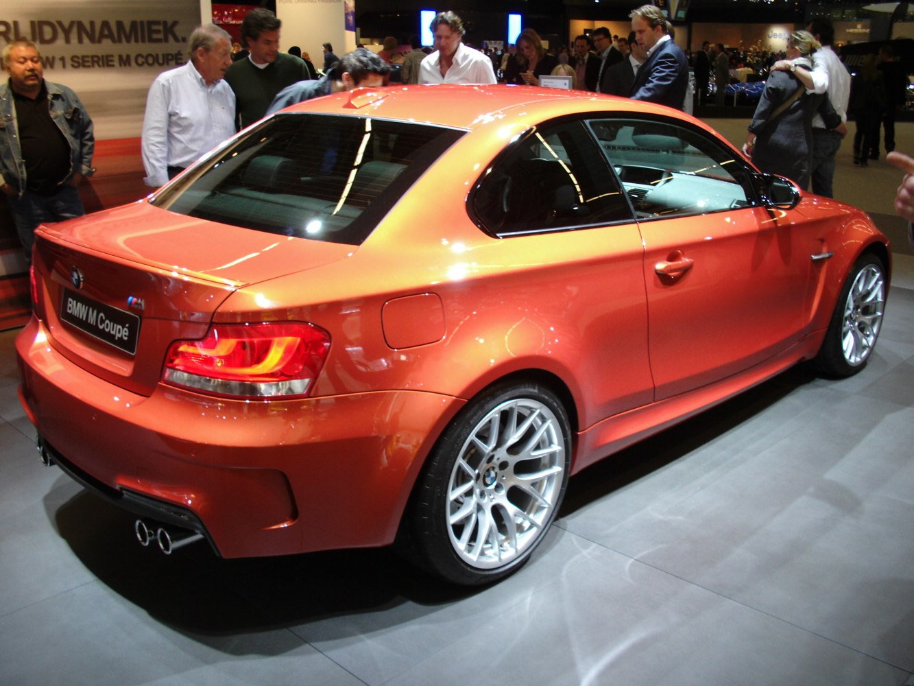 Sporty rear design with quad exhaust and multi-spoke alloy wheels
