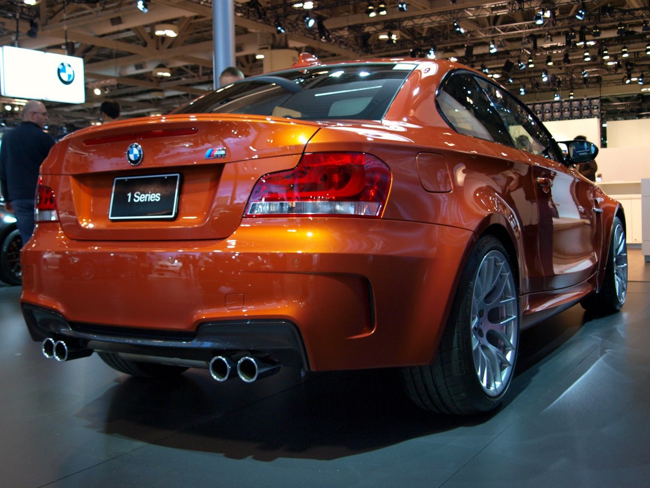 Rear view of a sporty coupe with quad exhausts and alloy wheels