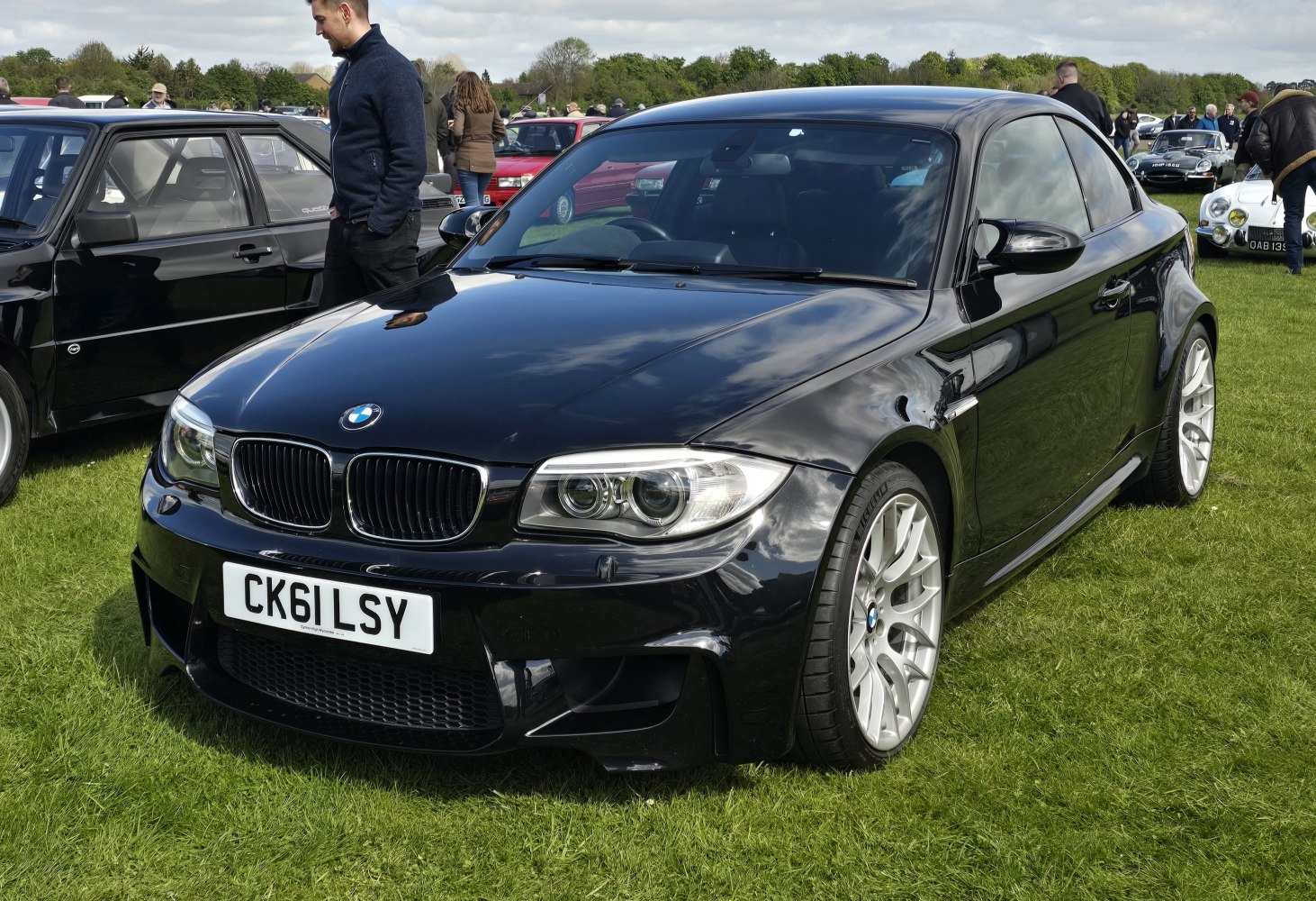 Black sporty coupe with aggressive front and silver alloy wheels