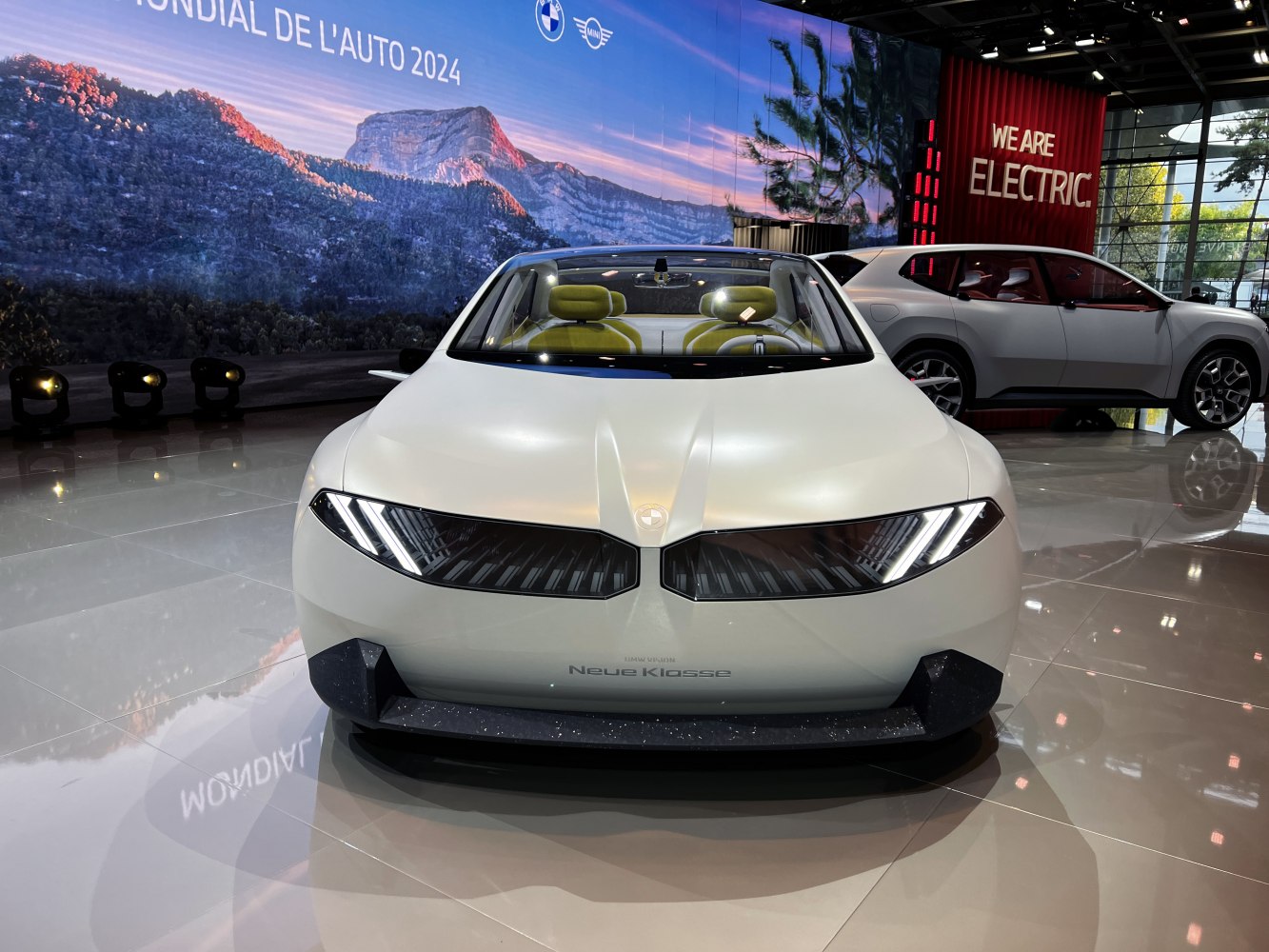 Futuristic front view with distinctive LED headlights and smooth aerodynamic design