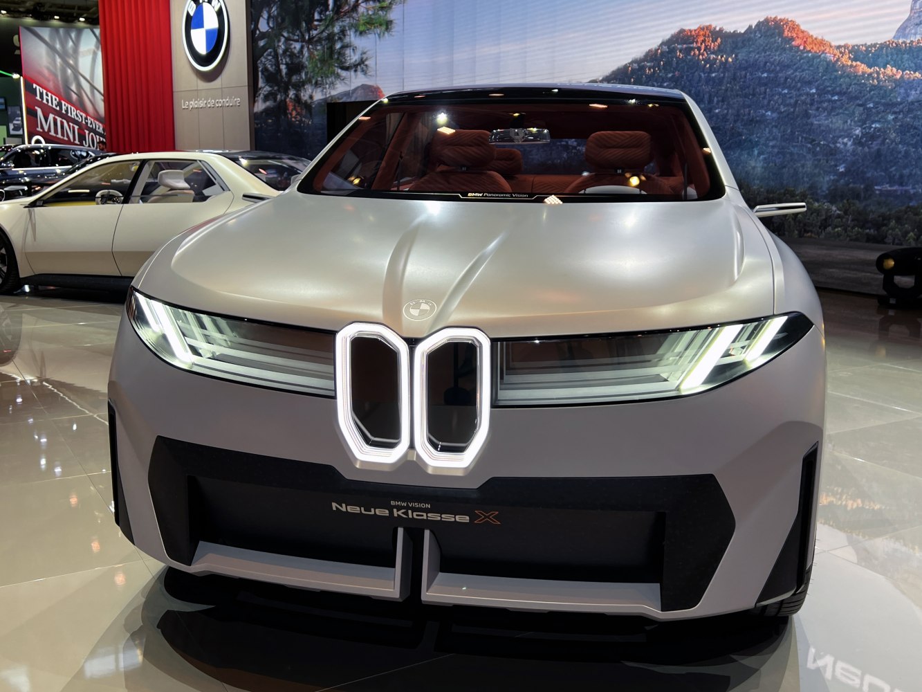 Futuristic front view with illuminated kidney grille and sleek LED headlights