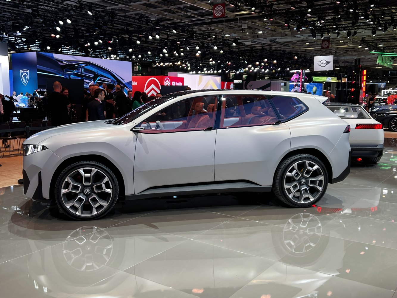 Side profile of a sleek electric SUV concept with aerodynamic design and large alloy wheels