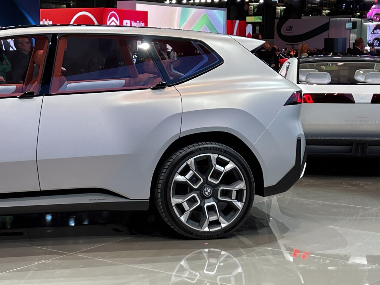 Rear side view with distinctive wheel design and unique rear profile