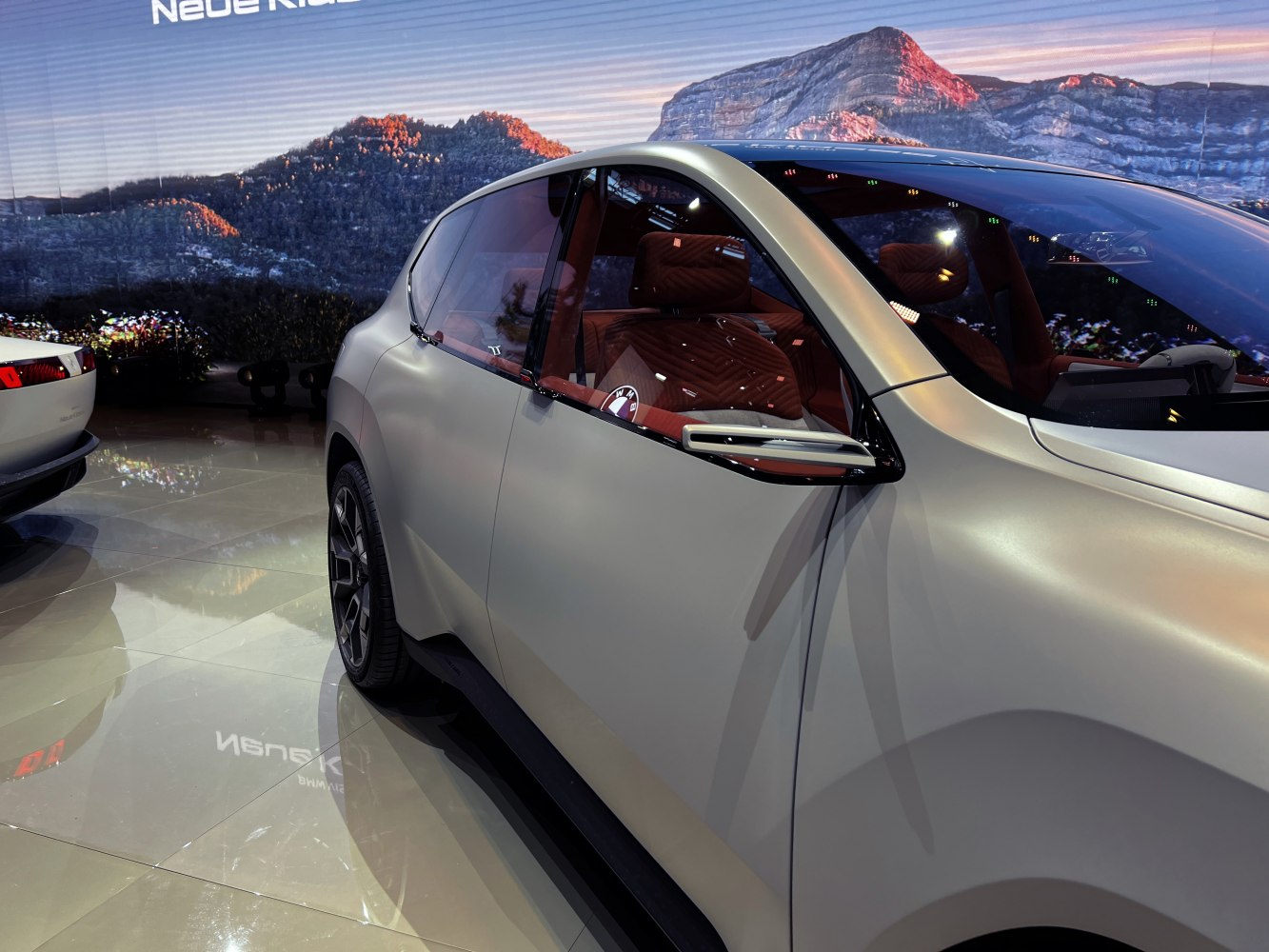 Futuristic side profile with unique window design and interior view.