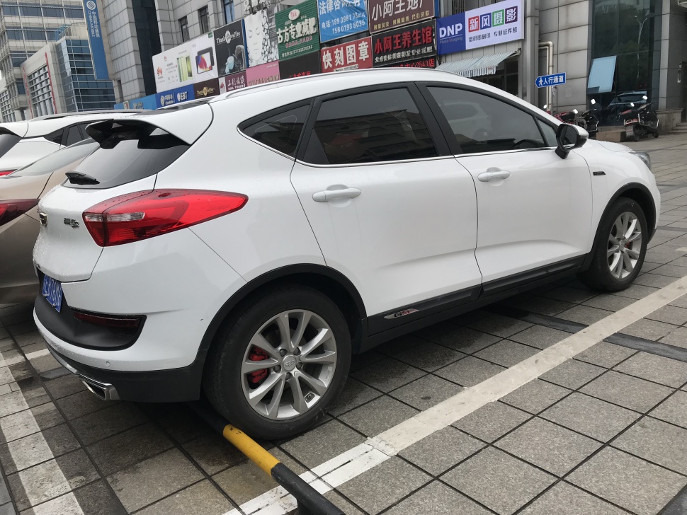 White hatchback sport trim rear and side profile with alloy wheels