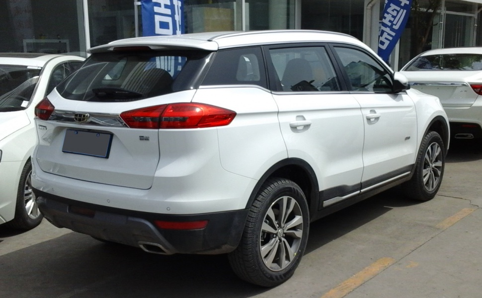 White SUV rear side view with alloy wheels and modern tail lights.