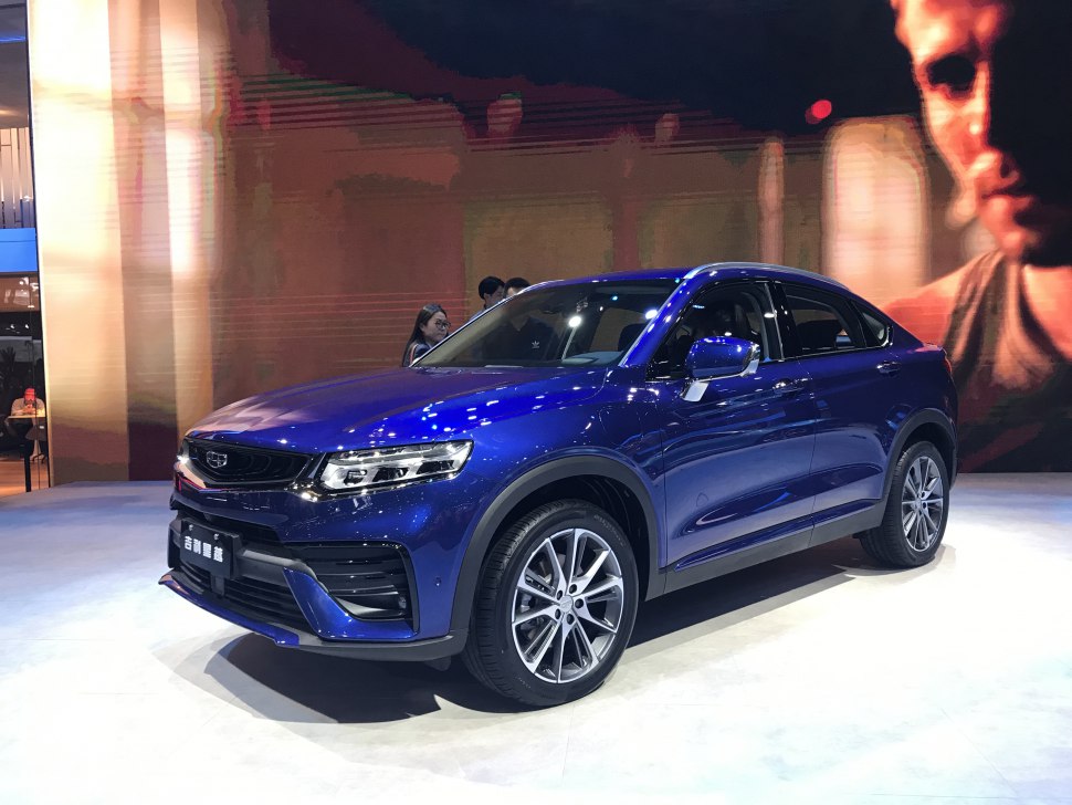 Blue crossover SUV with LED headlights and sporty alloy wheels.