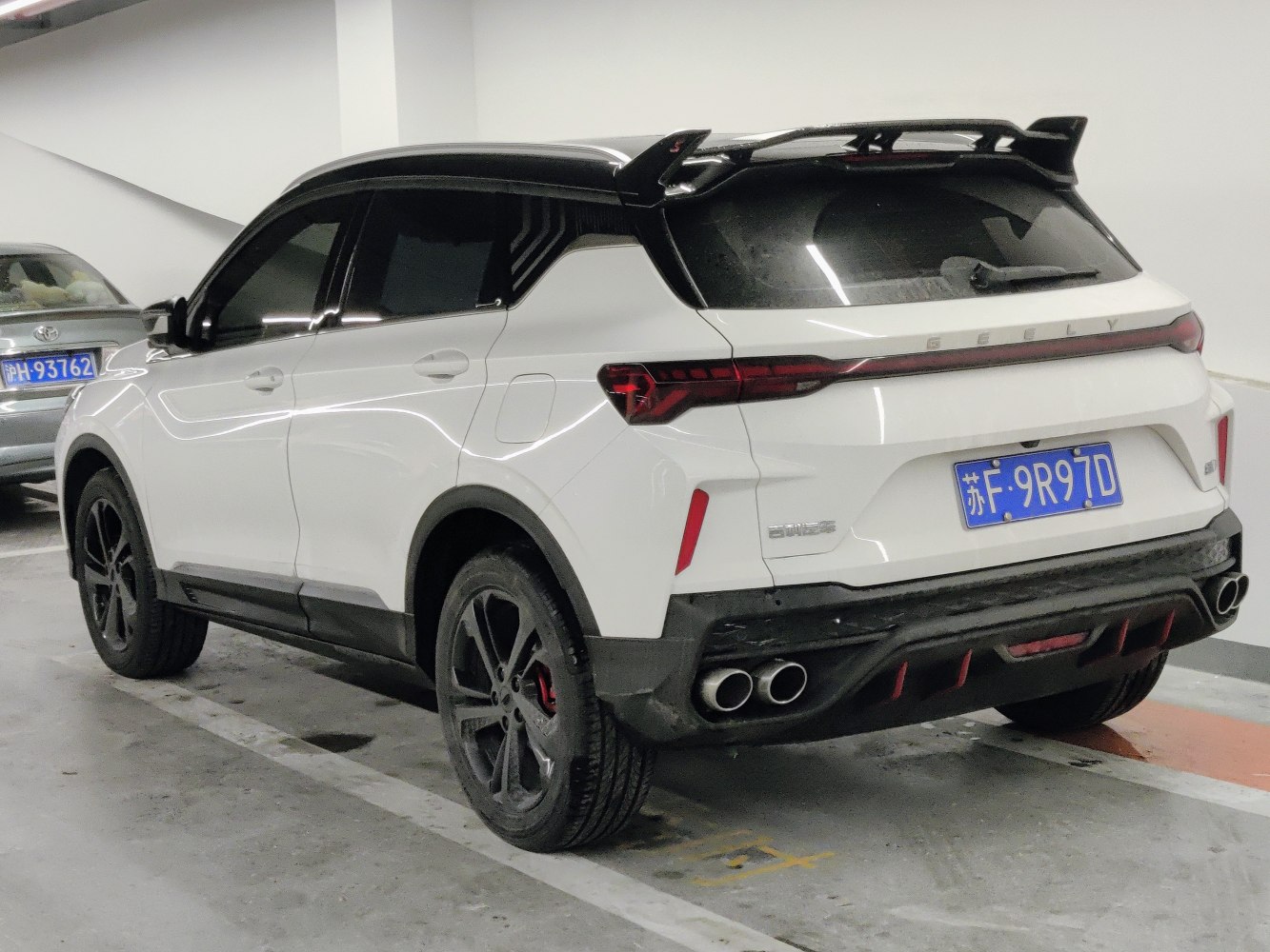 Modern SUV rear with dual exhausts and sleek tail lights