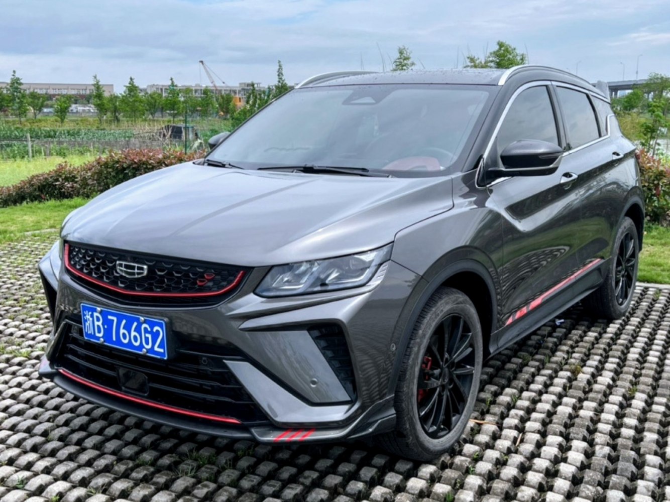Compact SUV front view with sporty grille and red trim accents