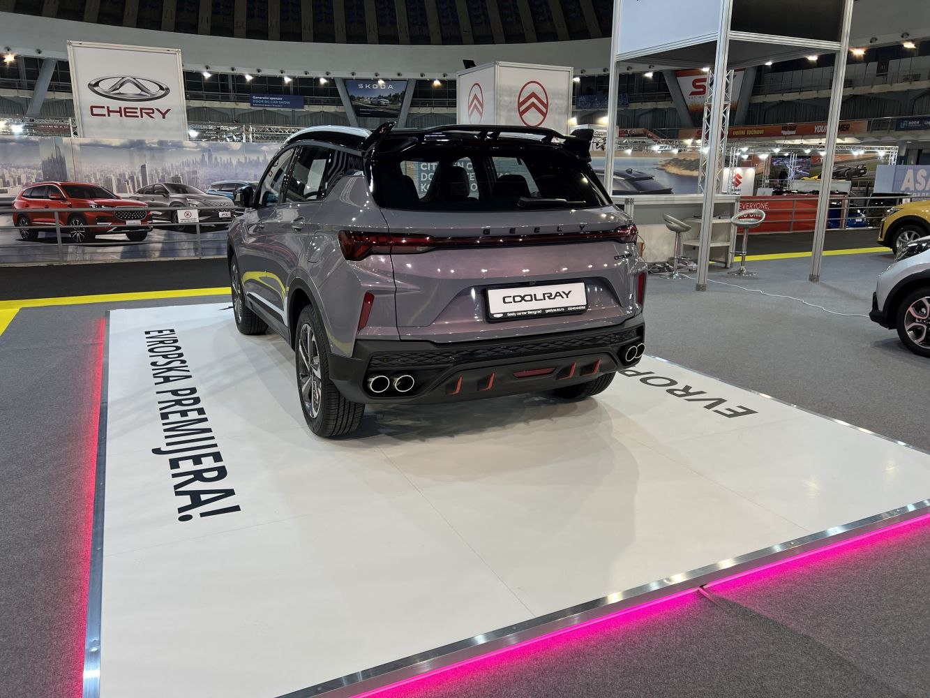 Rear view with quad exhausts and sporty roof spoiler