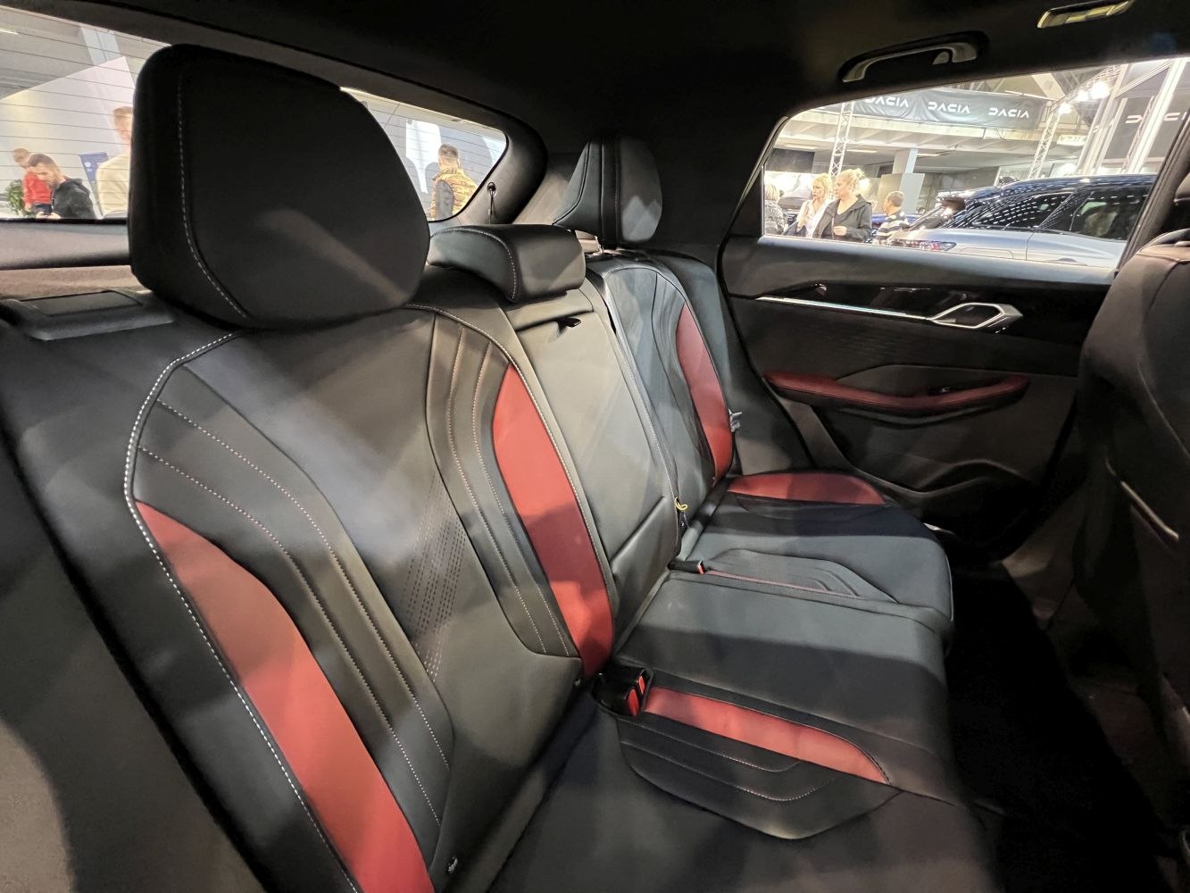 Rear seat interior with black and red two-tone leather upholstery