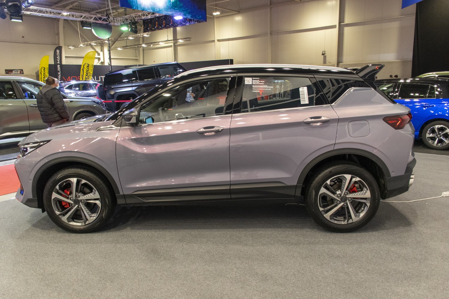 Side profile with alloy wheels and rear spoiler