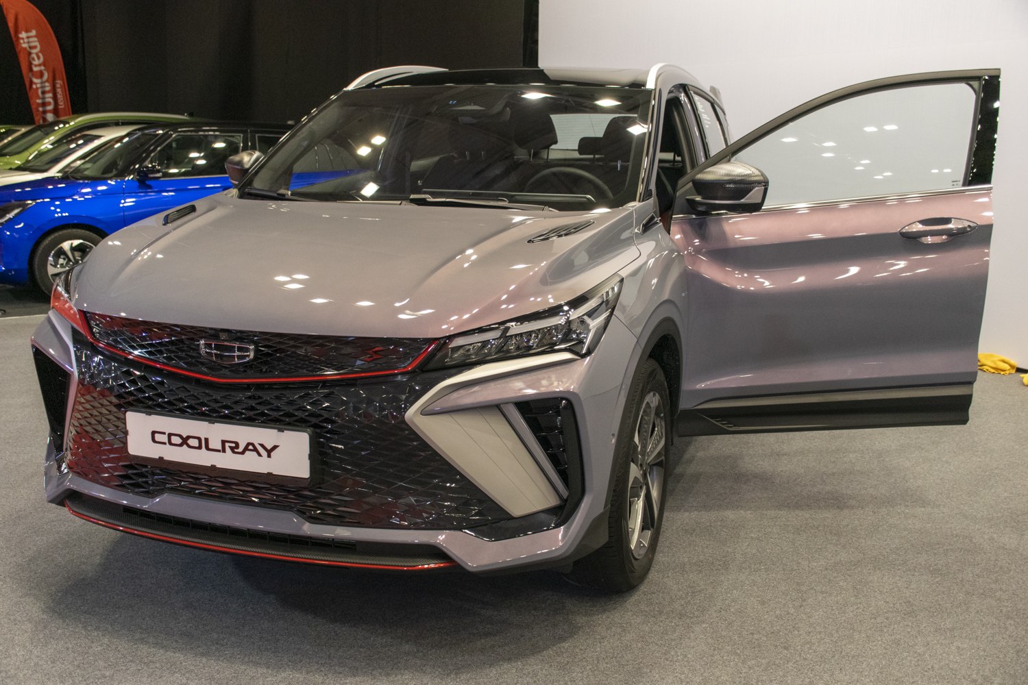 Front view of SUV with aggressive grille and open front door