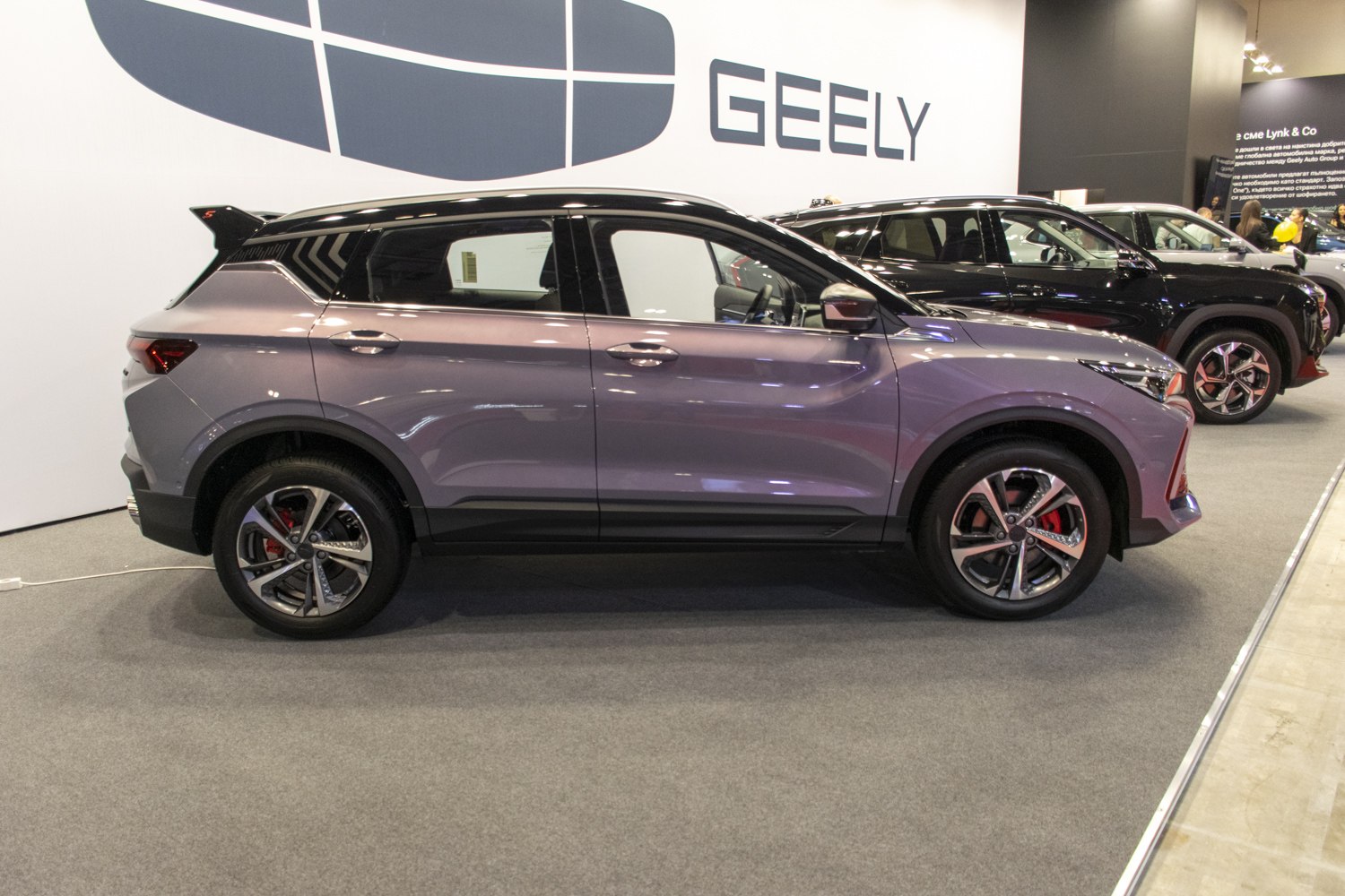 Side profile of SUV with sporty rear spoiler and alloy wheels