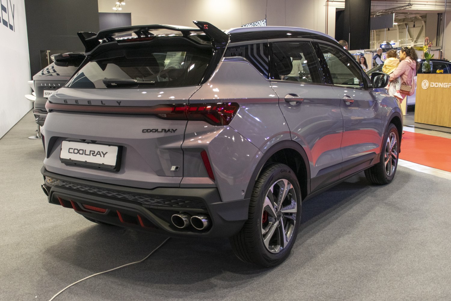 Rear view of sporty SUV with spoiler and dual exhaust pipes