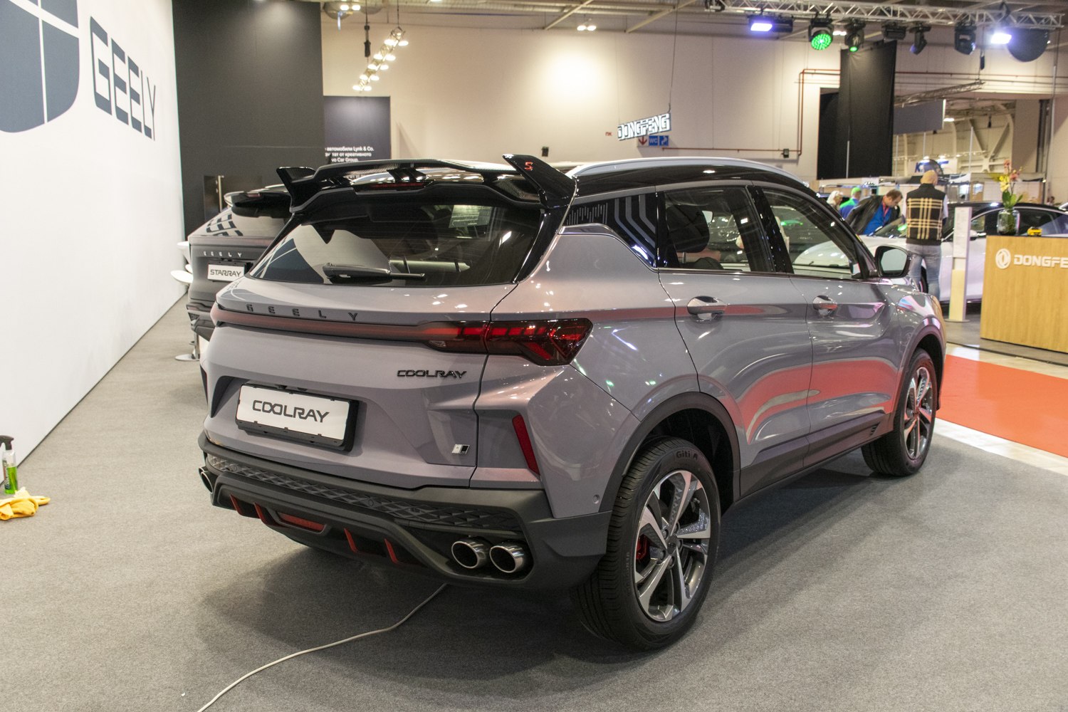 Rear view of a sporty SUV with dual exhausts and a spoiler