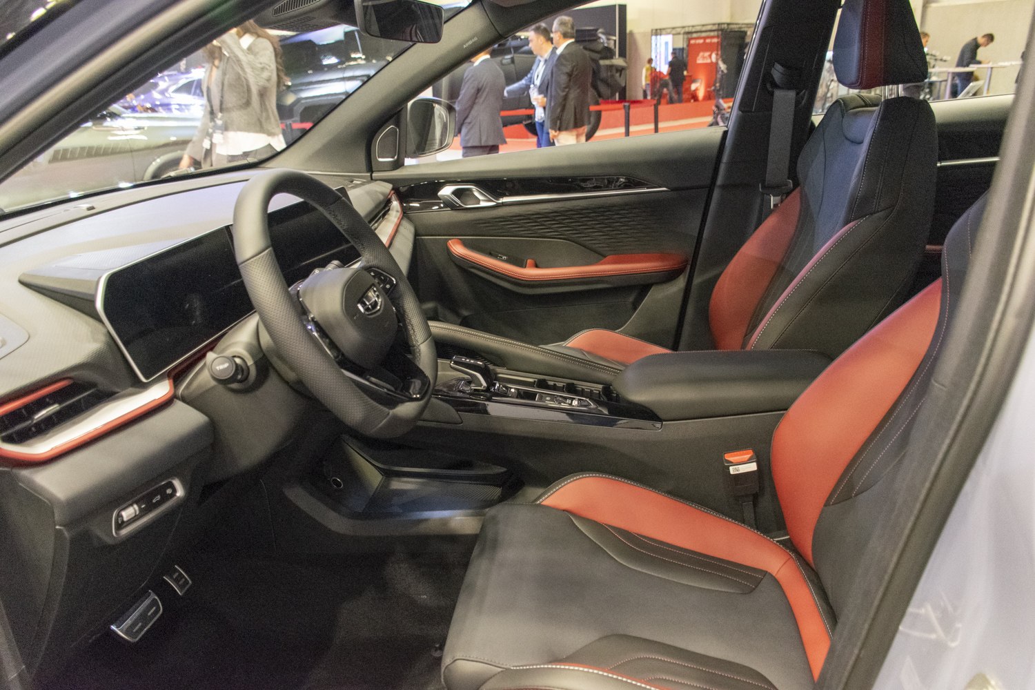 Luxury red-accented seats and modern digital dashboard interior