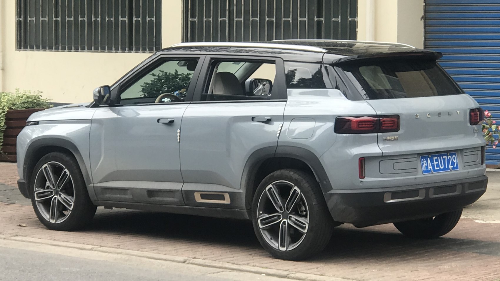 Side and rear profile of a modern compact SUV with bold design
