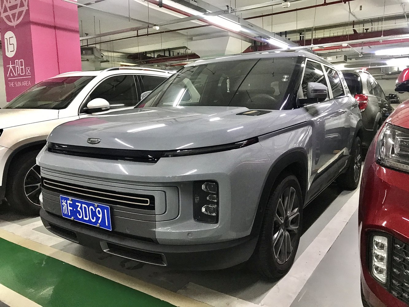 Modern SUV front with LED headlights and wide grille in silver color.