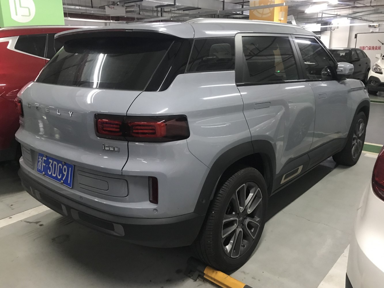 Rear and side view of an SUV with unique taillights and alloy wheels