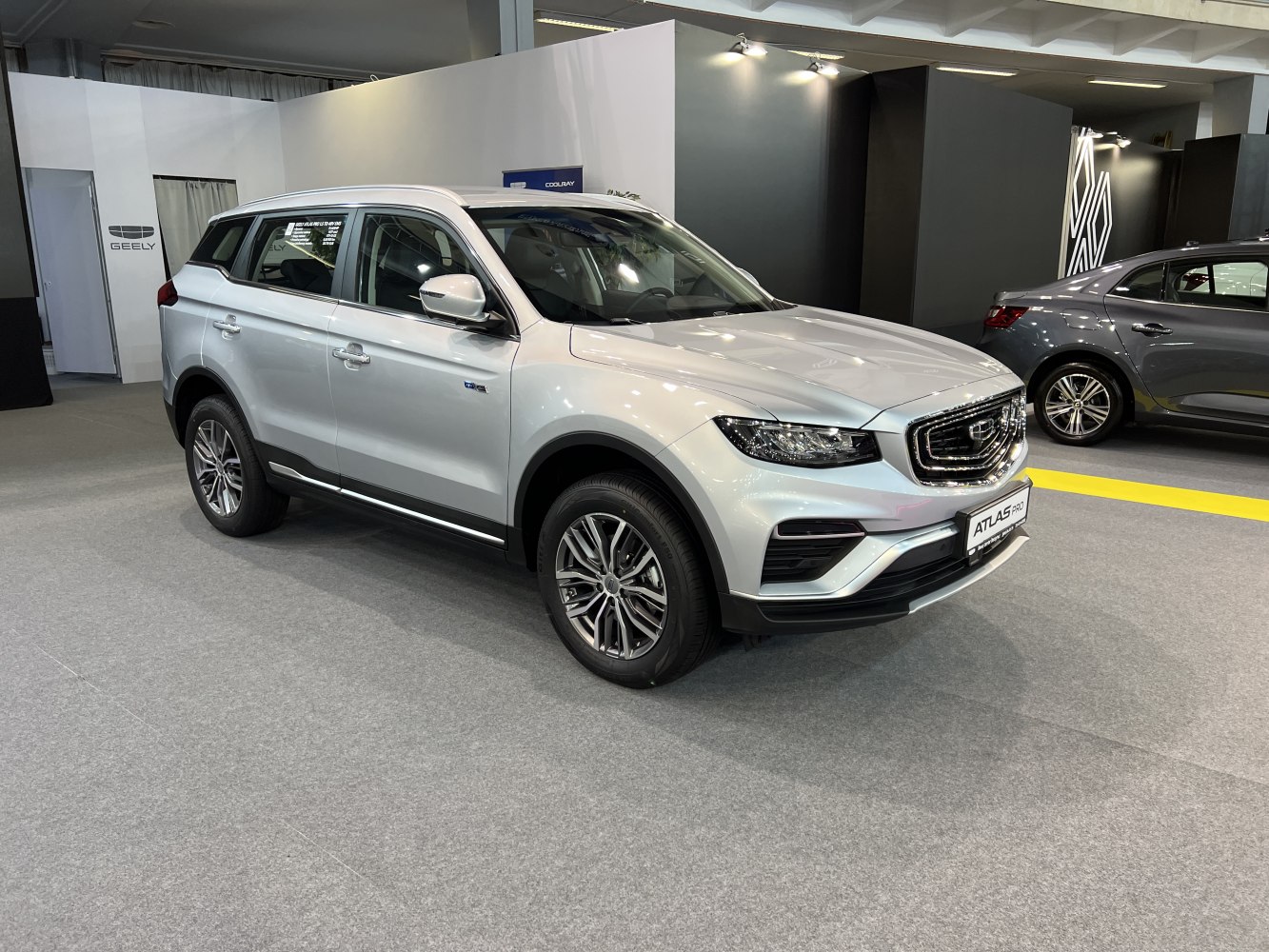Front three quarter view of modern SUV with bold grille and sleek headlights