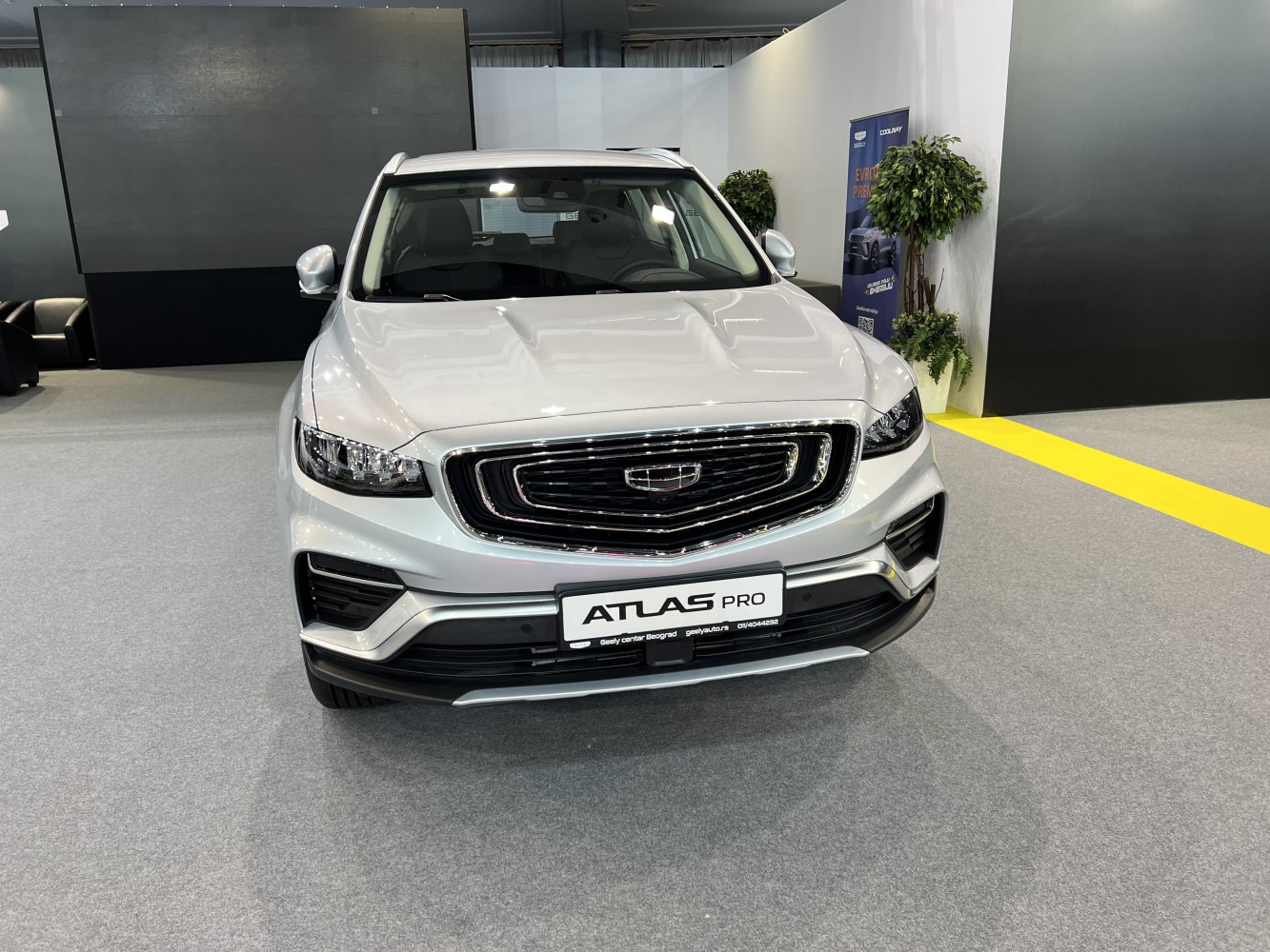 Front view of a modern SUV with bold grill and advanced headlights