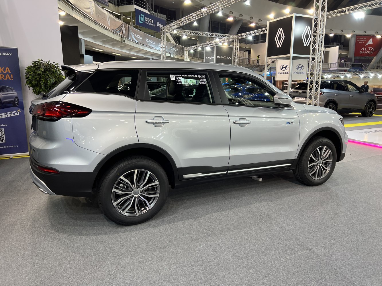 Side profile of a modern mid-size SUV with alloy wheels and sharp rear design