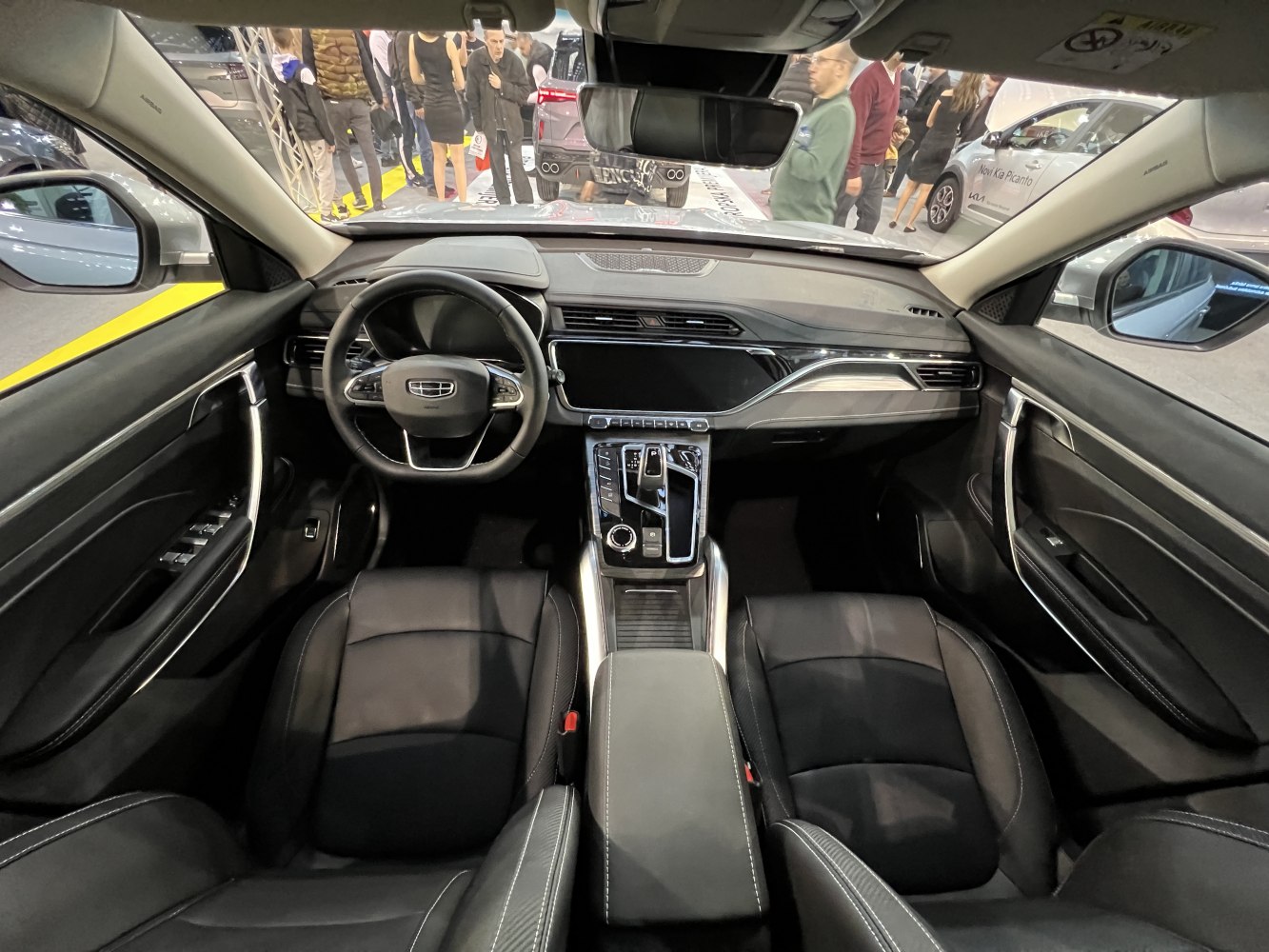 Modern car interior with dashboard, steering wheel, and center console