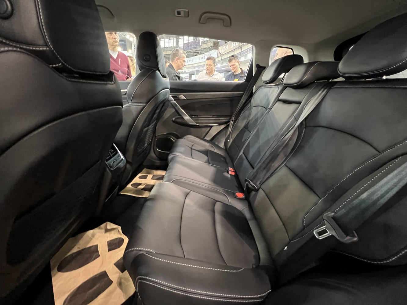 Black leather backseat with detailed stitching and spacious rear cabin