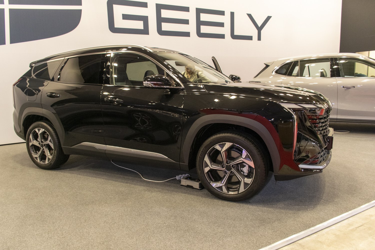 Sleek black SUV with modern alloy wheels and side profile view
