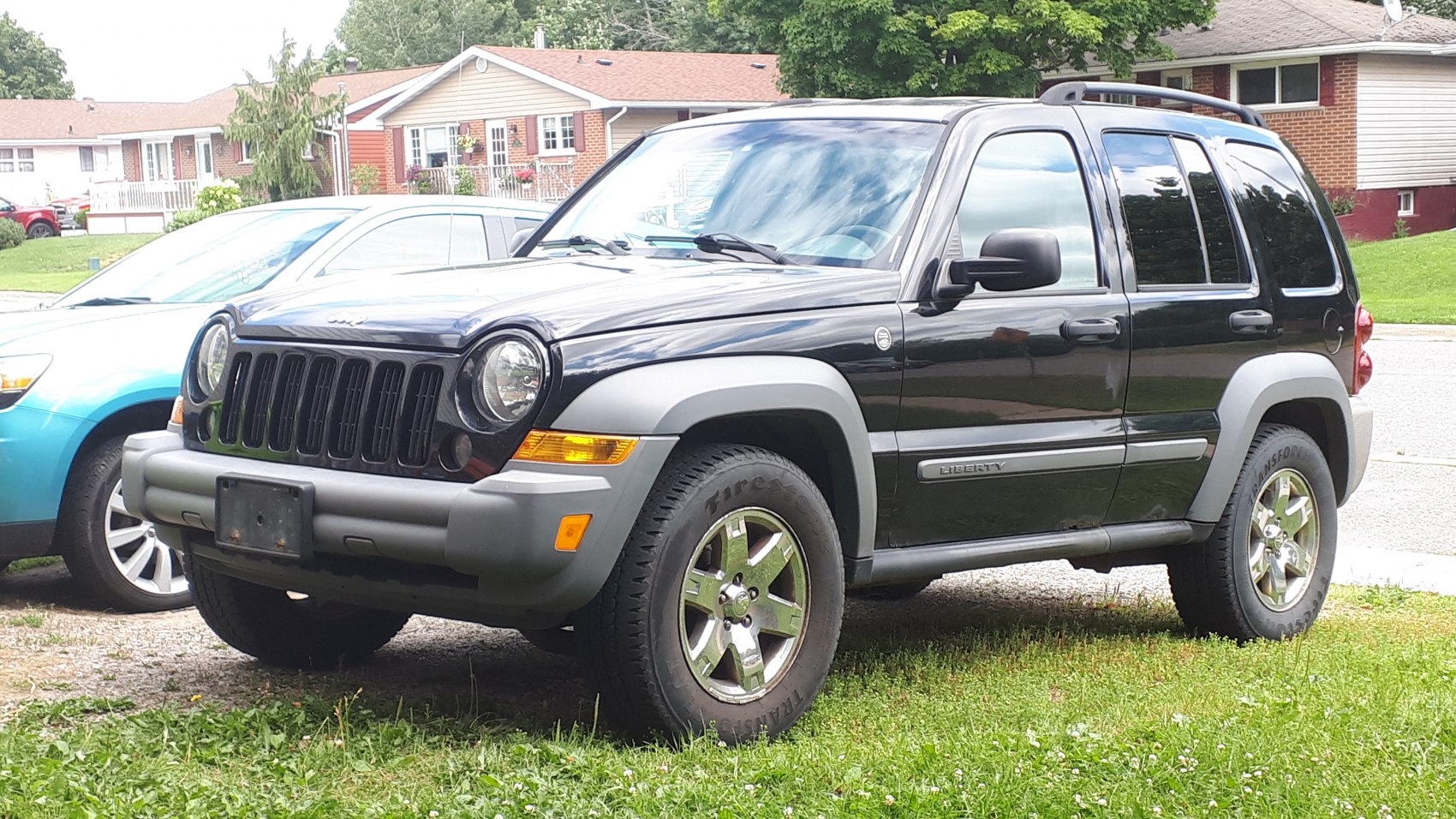 SUV with round headlights, rugged fender flares, and roof rails