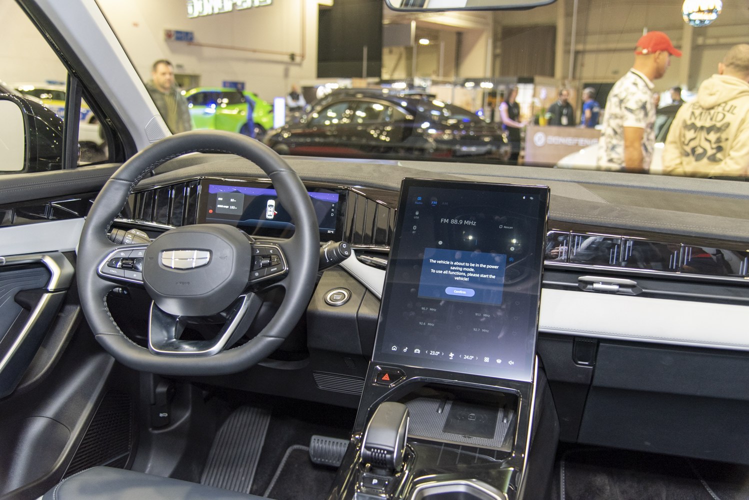 Steering wheel with digital cluster and large vertical touchscreen display