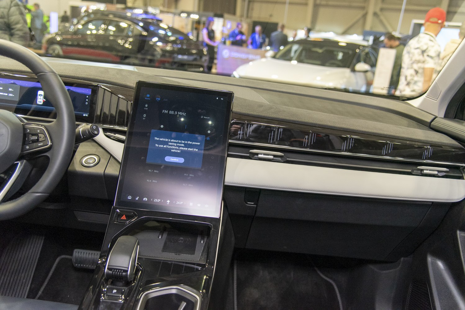 Modern car interior with large touchscreen and digital instrument cluster