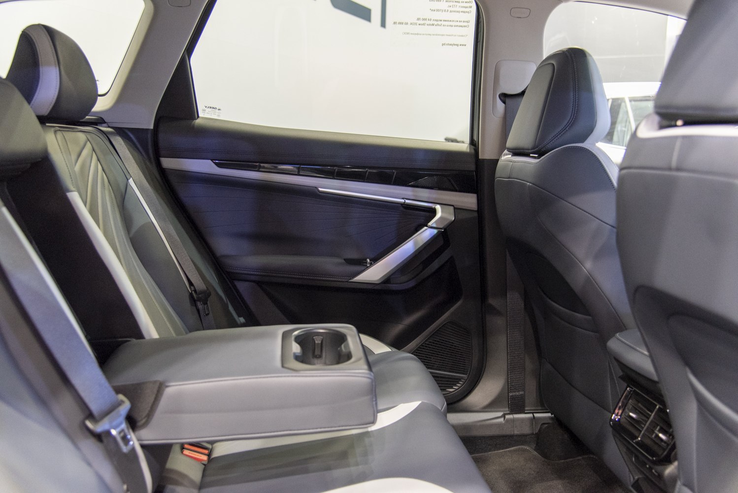 Rear interior with fold-down armrest and cup holder