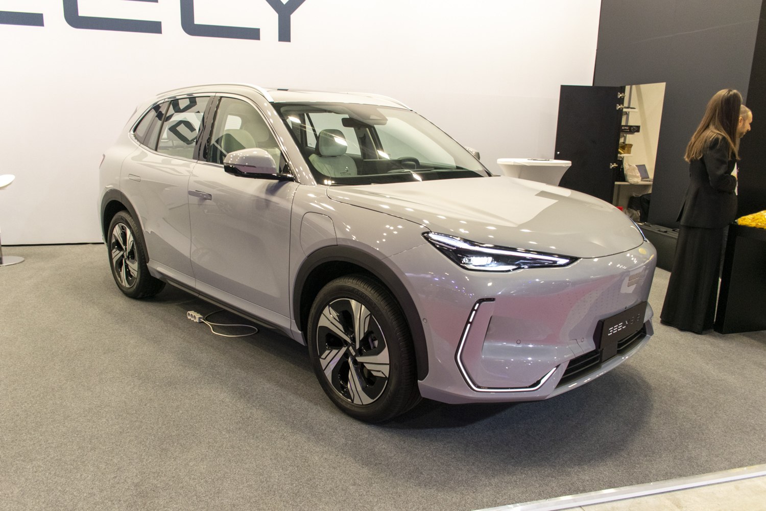 Front view of SUV with sleek LED headlights and aerodynamic shape