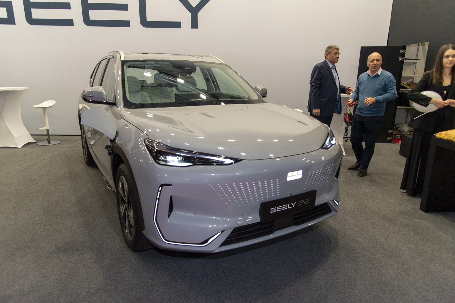 Front view of electric SUV with LED headlights and futuristic design