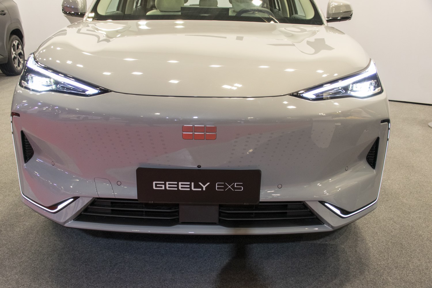 Sleek LED headlights and aerodynamic front fascia with black grille vents.