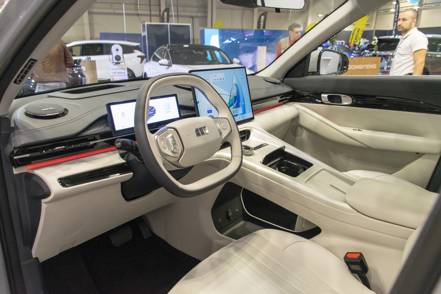 Modern digital dashboard and steering wheel controls with sleek interior design