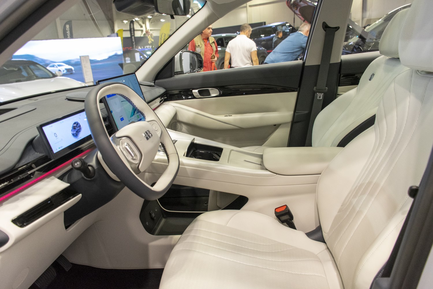 Interior with white leather seats and dual digital dashboard display
