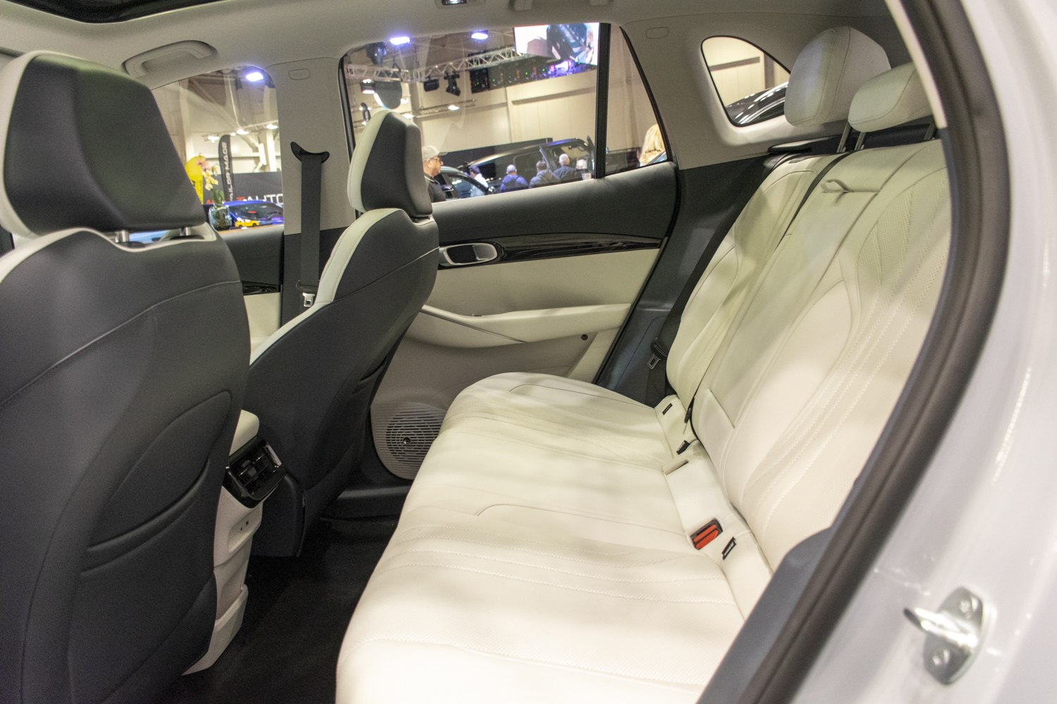 Spacious rear seat with light leather upholstery and modern design