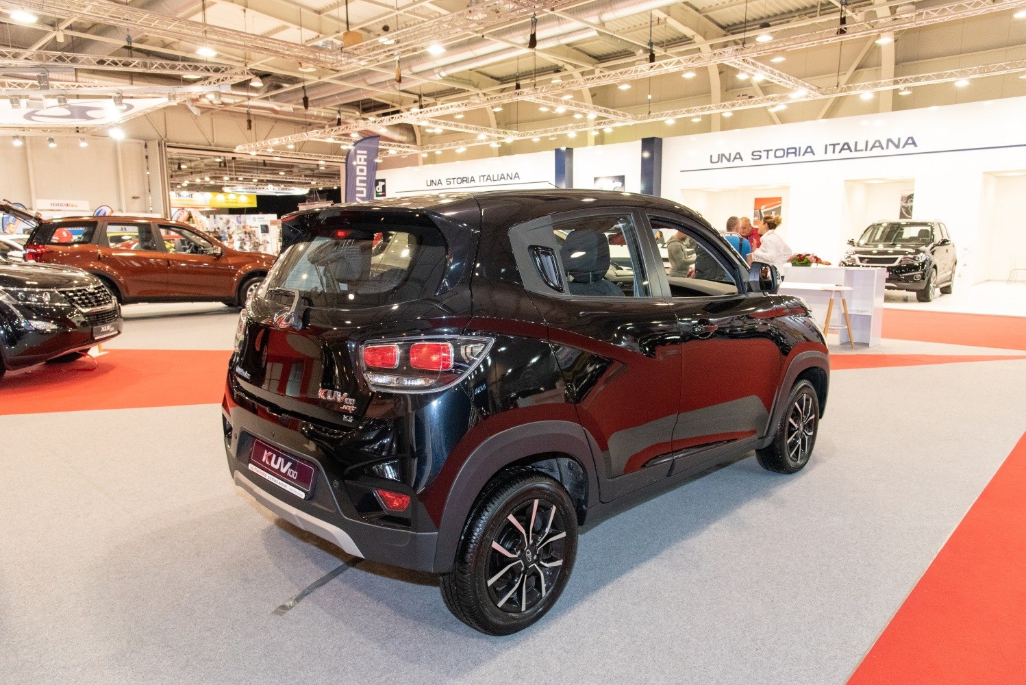 Rear side view of small SUV with modern taillights and sporty wheels