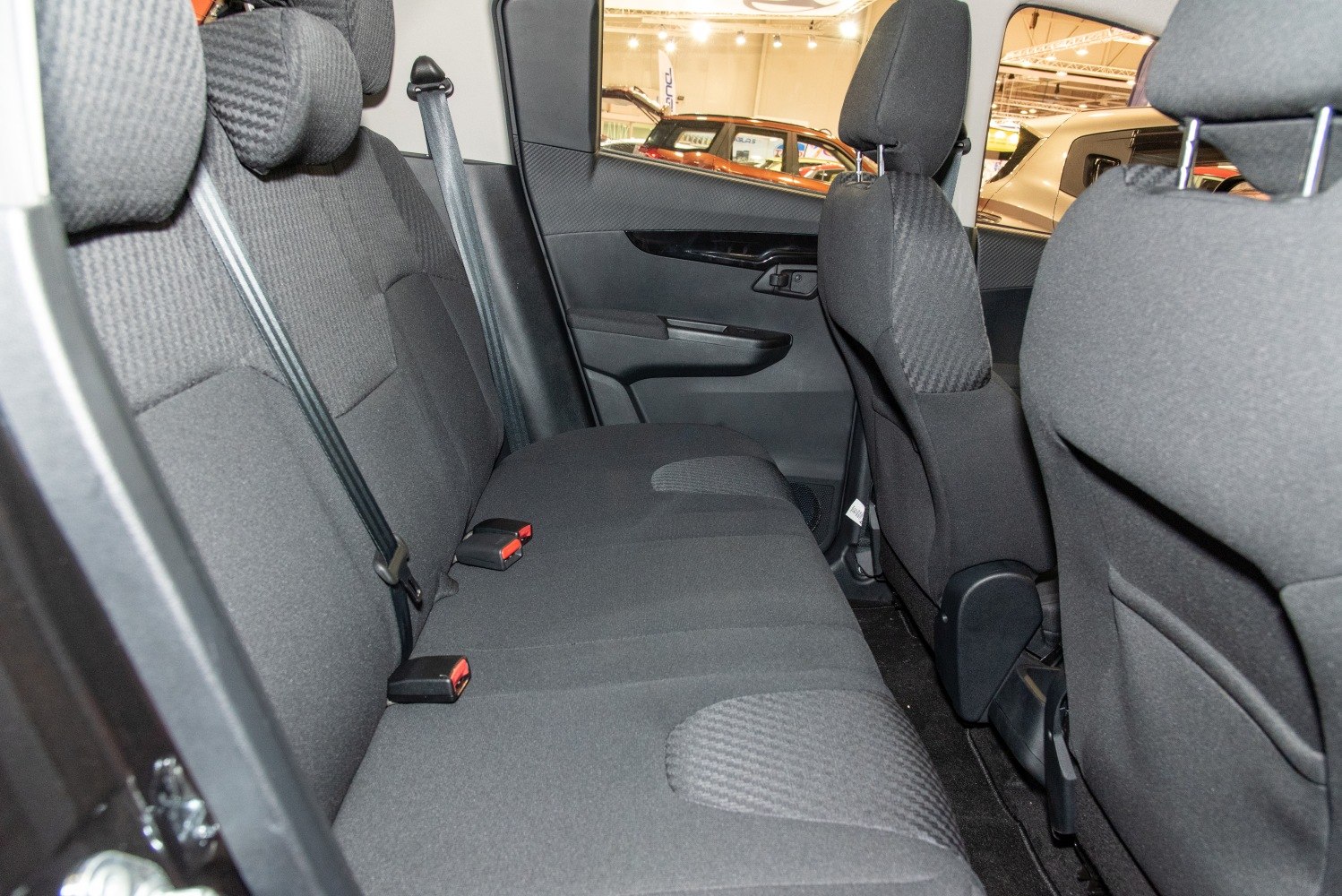 Rear seat interior with black fabric upholstery and headrests