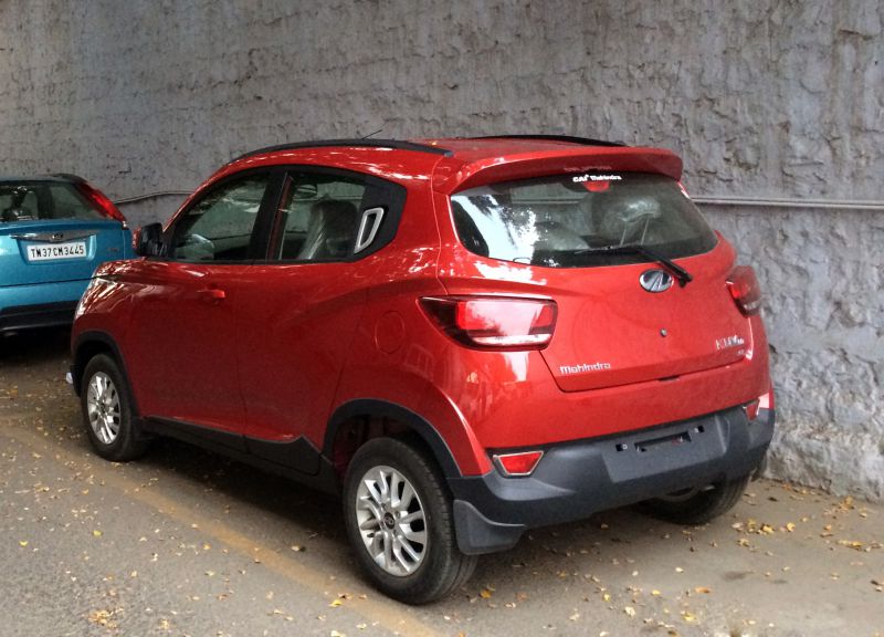 Red compact SUV rear and side with tail lights and alloy wheels