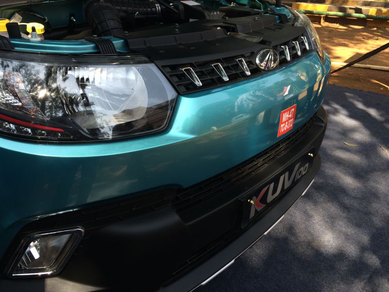 Close-up of front grille and headlight assembly with bumper