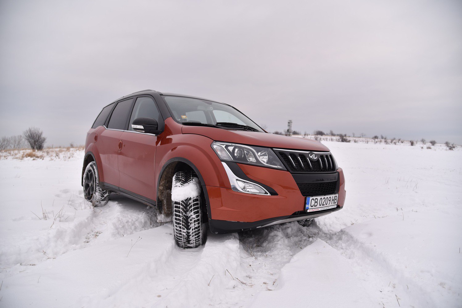 SUV front grille and headlamps in snow